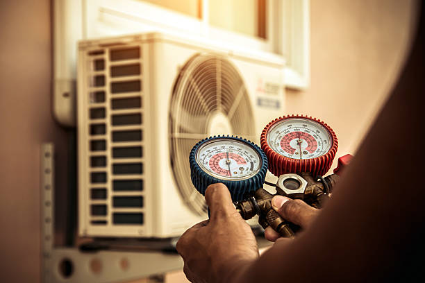 Professional Air Conditioning Service technician working in Grimes, IA